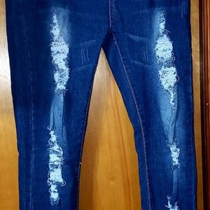 Dark blue distressed skinny jeans